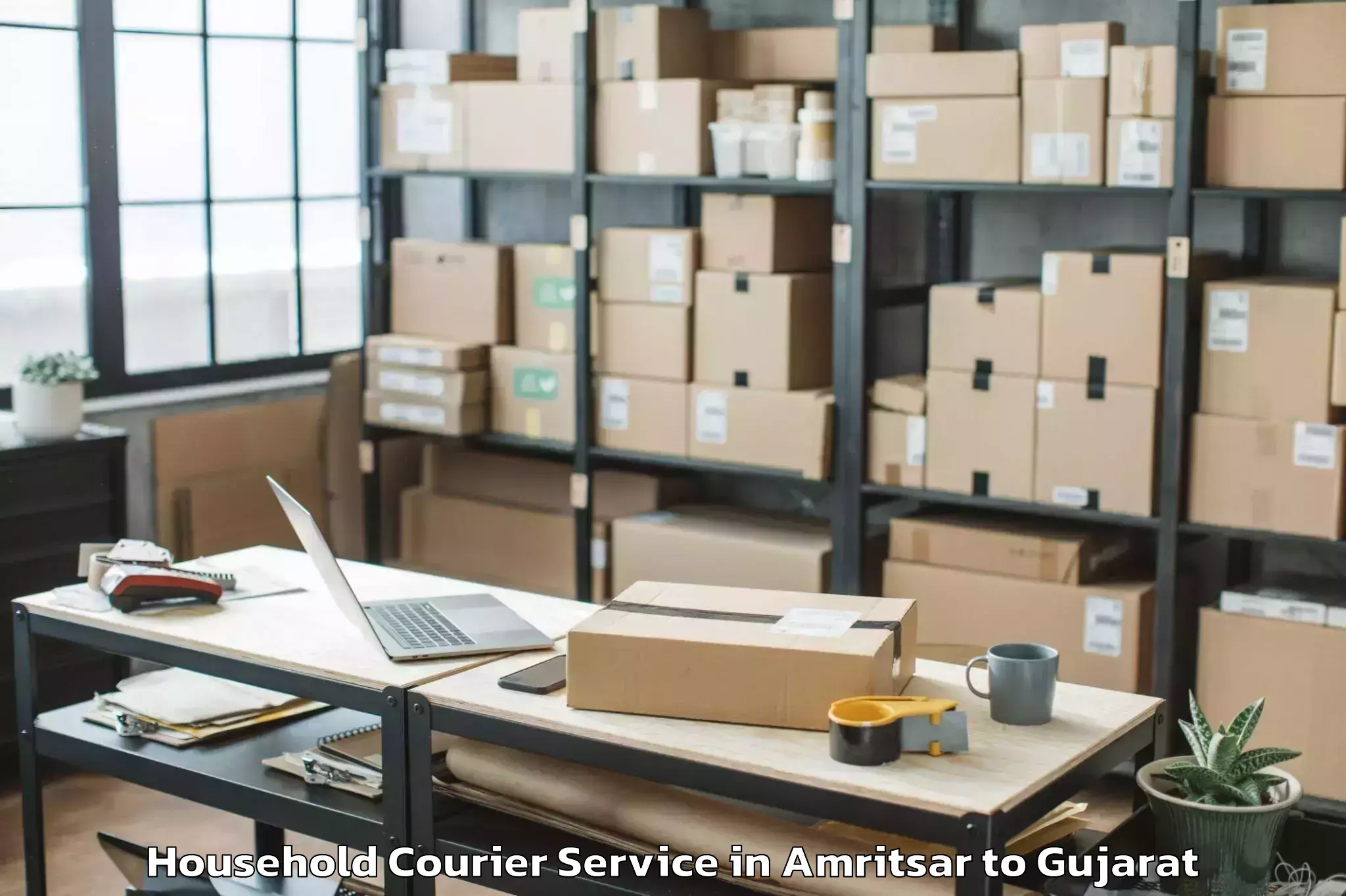 Book Amritsar to Navrangpura Household Courier Online